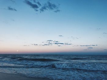 Scenic view of sea against sky at sunset