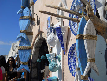 Low angle view of decorations hanging at market