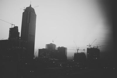 Silhouette of buildings against sky