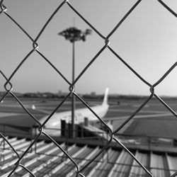 Close-up of chainlink fence against clear sky
