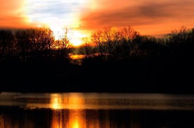 Scenic view of lake against sky during sunset