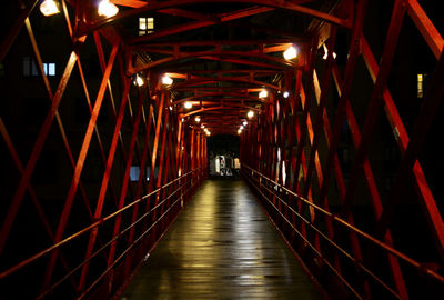 Man on illuminated walkway