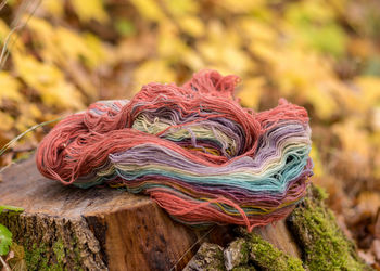 Colored wool yarn skeins on a fuzzy background, handicraft concept, hand knitting, autumn time