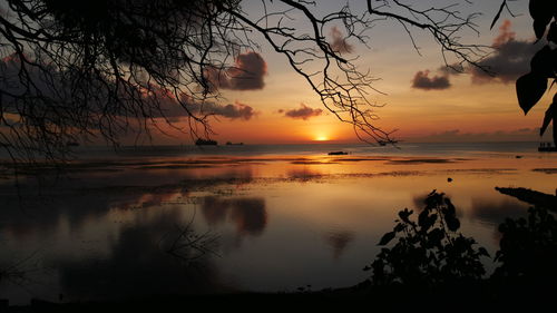 Scenic view of sea against orange sky