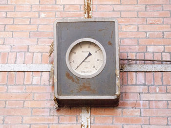 Close-up of number on brick wall