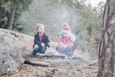 Children playing with trees