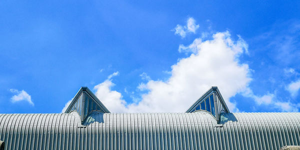 Low angle view of building against blue sky