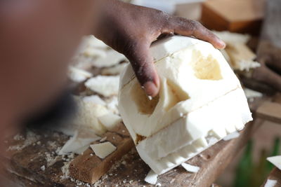 Close-up of hand holding ice cream