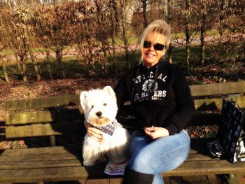 Portrait of cute dog sitting outdoors