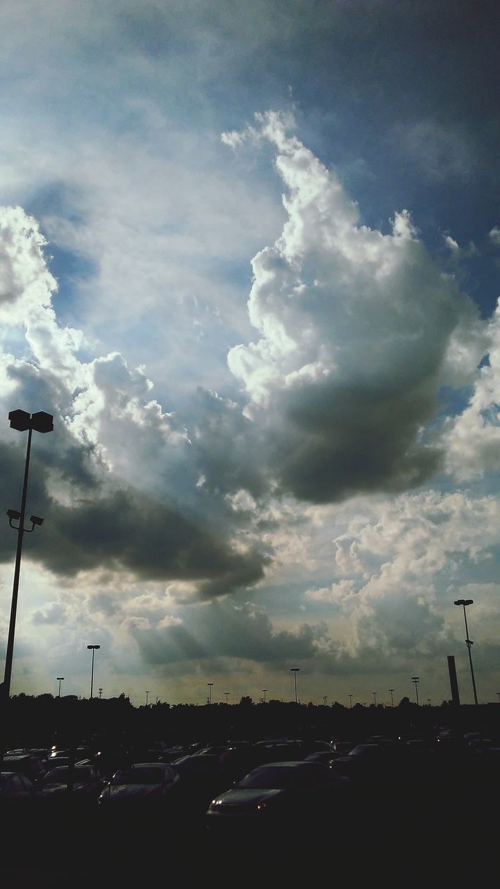 CAR ON ROAD AGAINST SKY