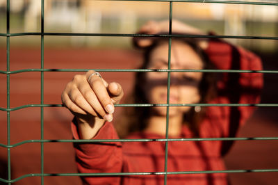 Close-up of man holding metal