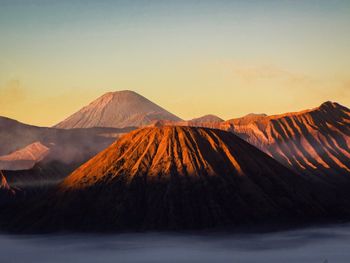 View of volcanic mountain during sunset