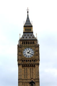 Low angle view of clock tower against sky