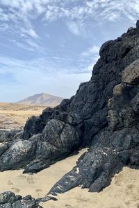 Rock formations on landscape against sky