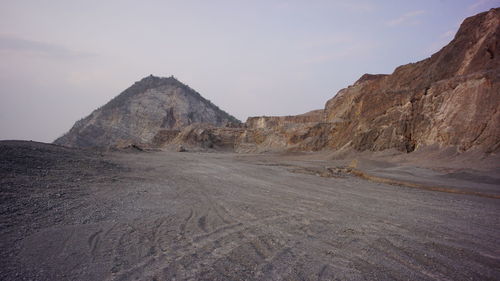 Rock formations in desert against sky