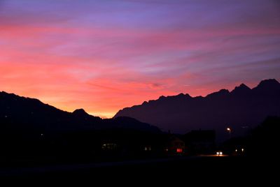 Silhouette mountains against sky at sunset