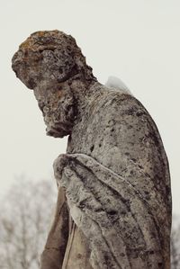 Low angle view of statue against sky