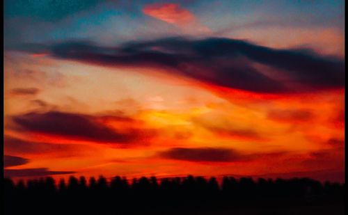 Scenic view of dramatic sky during sunset