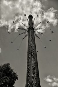 Low angle view of ferris wheel against sky