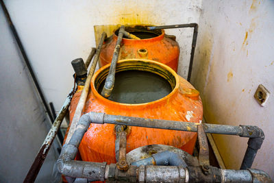 High angle view of dirty pipe with container