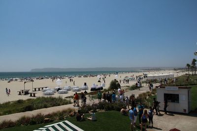 People relaxing on beach