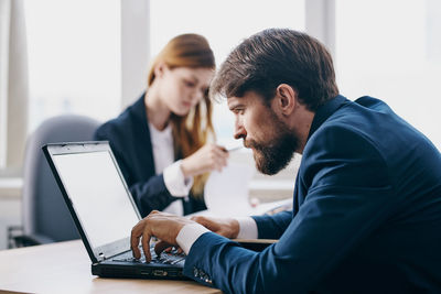 Business colleagues working at office