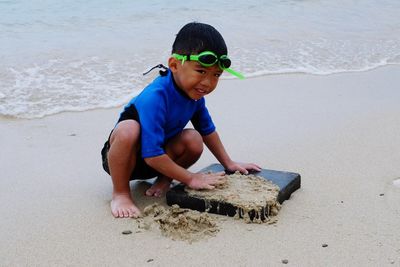 Full length of boy on beach