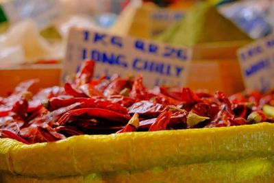 Close-up of red chilis for sale at market stall