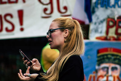 Portrait of young man using mobile phone