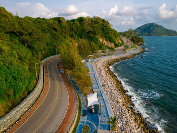 High angle view of road by mountain against sky