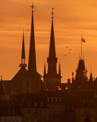 Buildings against sky during sunset