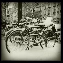 Cars parked on snow covered landscape
