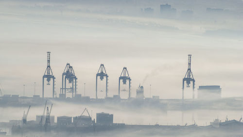 Panoramic view of factory against sky