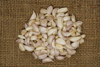 High angle view of garlics on jute