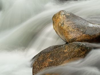 Close-up of water flowing through rocks