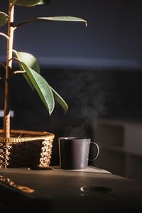 Close-up of illuminated candle on table