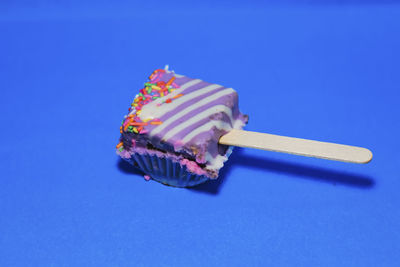 Close-up of dessert against blue background