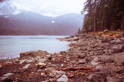 Scenic view of lake and mountains against sky