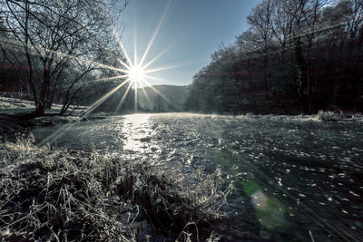 Scenic view of snow covered landscape against sky