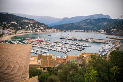 High angle view of river and townscape against sky