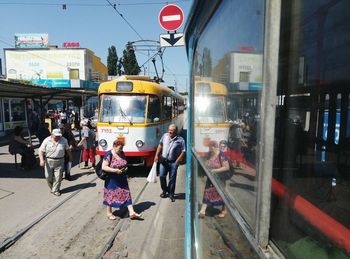 People on bus in city