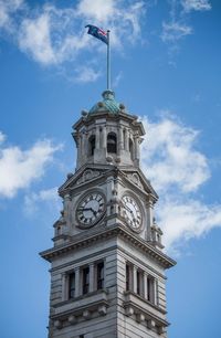 Low angle view of bell tower against blue sky