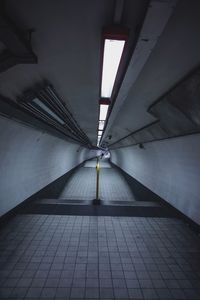 Interior of illuminated tunnel at subway station