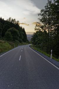 Road through the bavarian forest during sunset