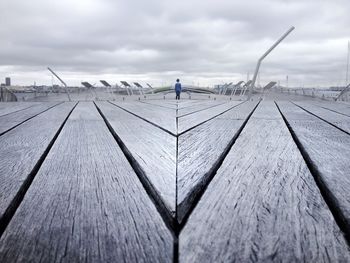 View of empty road against cloudy sky