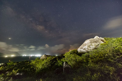 Scenic view of rocks against sky at night