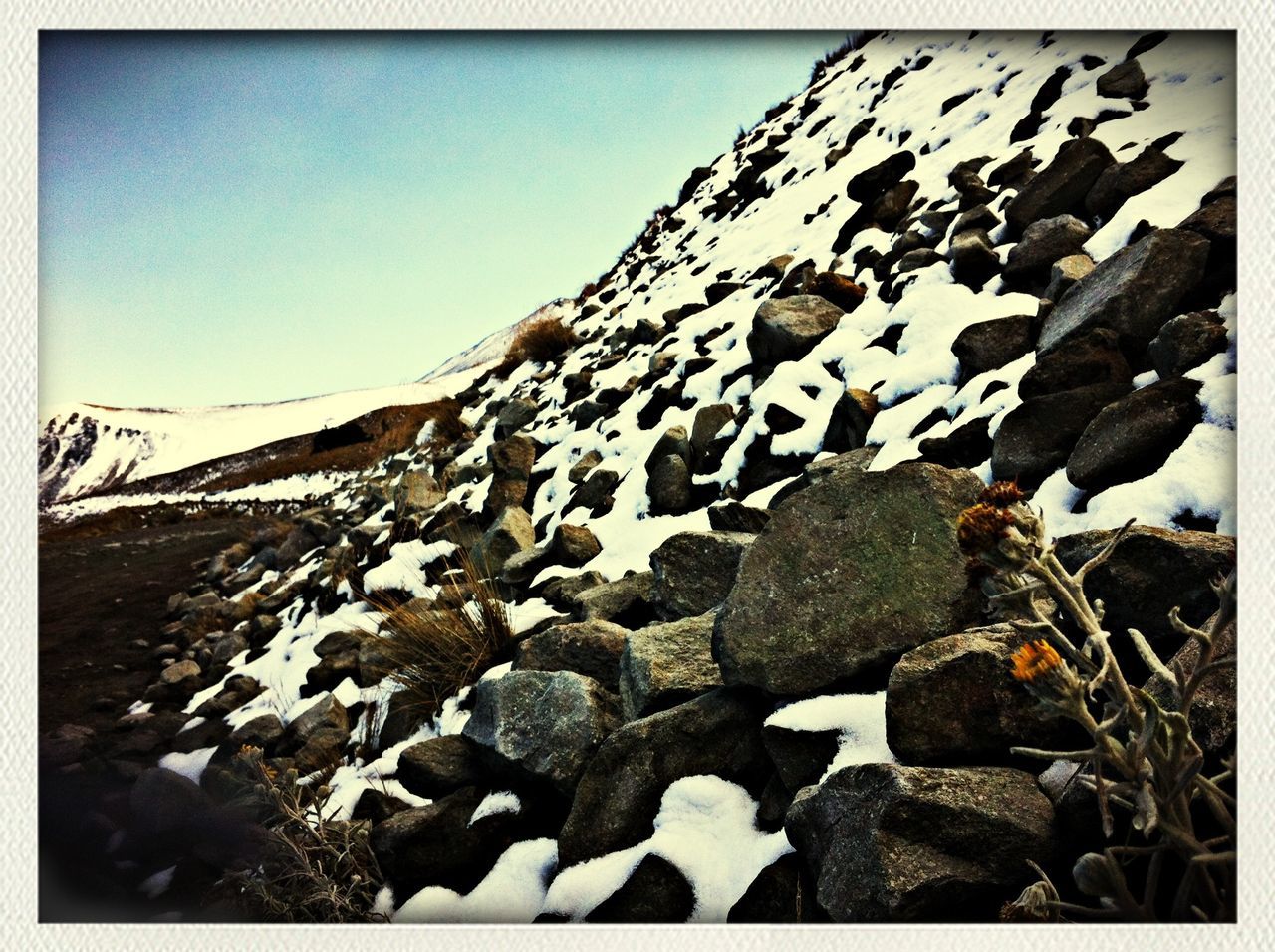 transfer print, auto post production filter, clear sky, sky, rock - object, sunlight, nature, tranquility, outdoors, day, stone - object, tranquil scene, landscape, blue, beach, wood - material, scenics, shadow, field, copy space