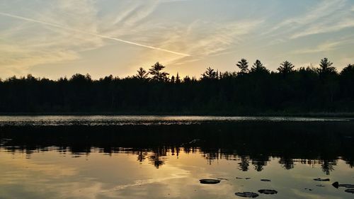 Scenic view of lake at sunset