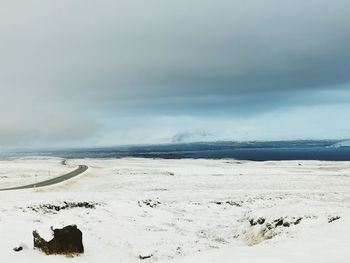 Scenic view of sea against sky during winter