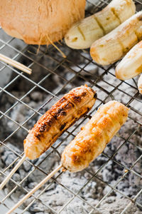 High angle view of meat on barbecue grill